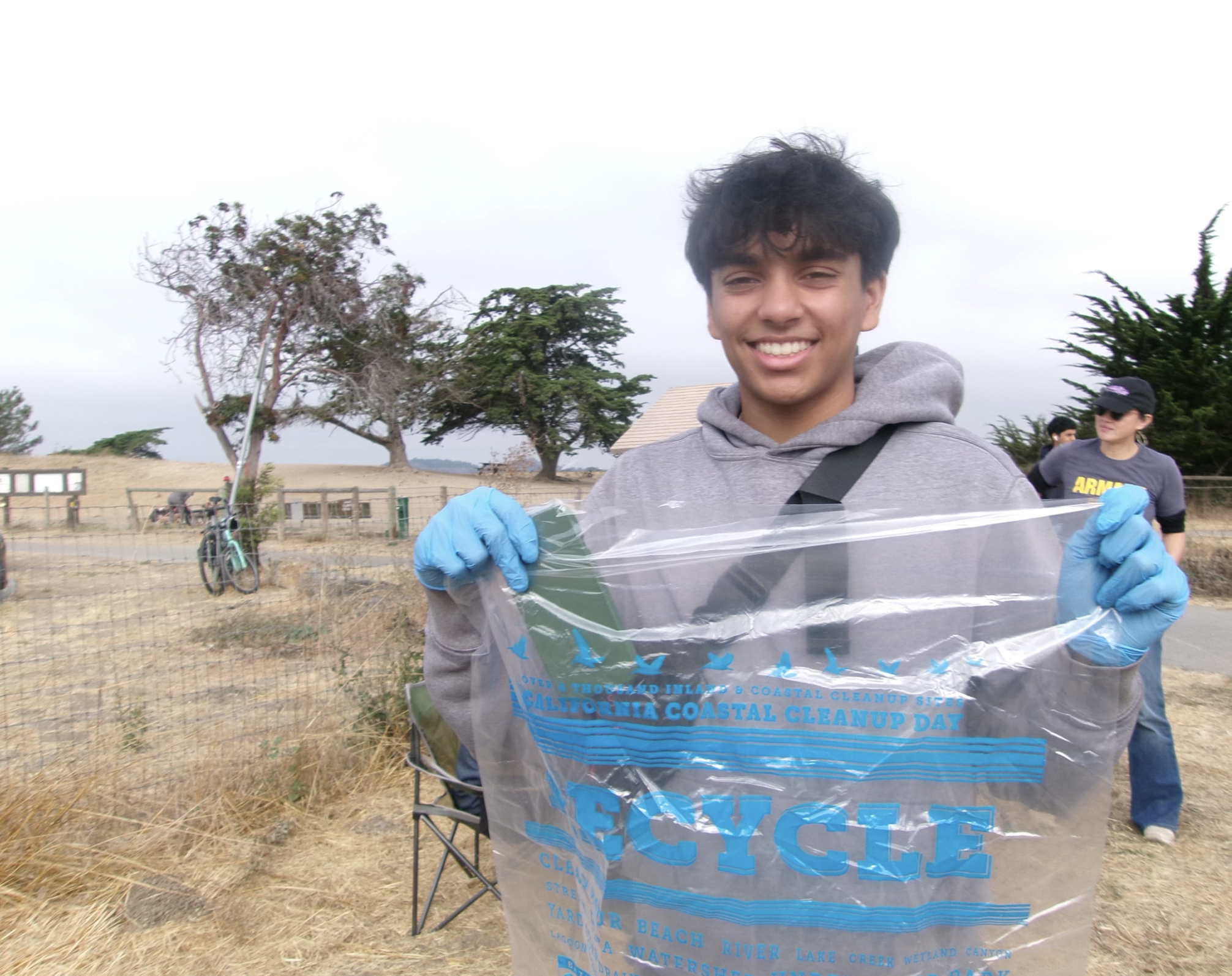 Image of Krishiv Jaini Holding up Trash